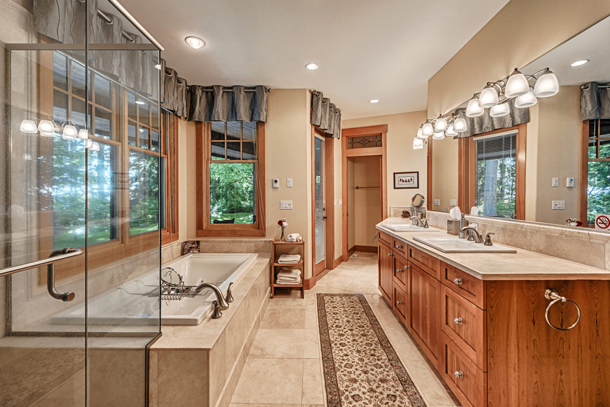 11 Luxurious Master Bath With Jacuzzi Tub Heated Travertine Floor And Water View Soaring